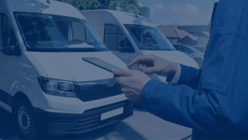0725 7.11 Release Blog Graphic_v1 a person holding a phone in front of a van