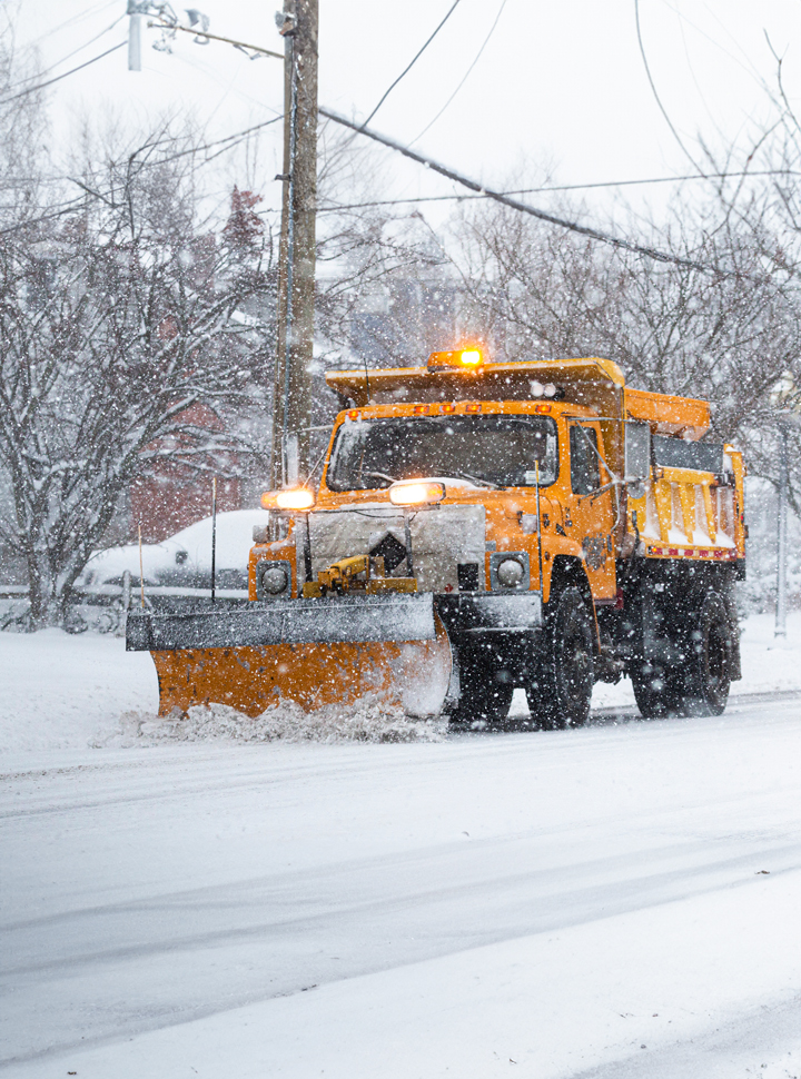 Snowplow plowing snow