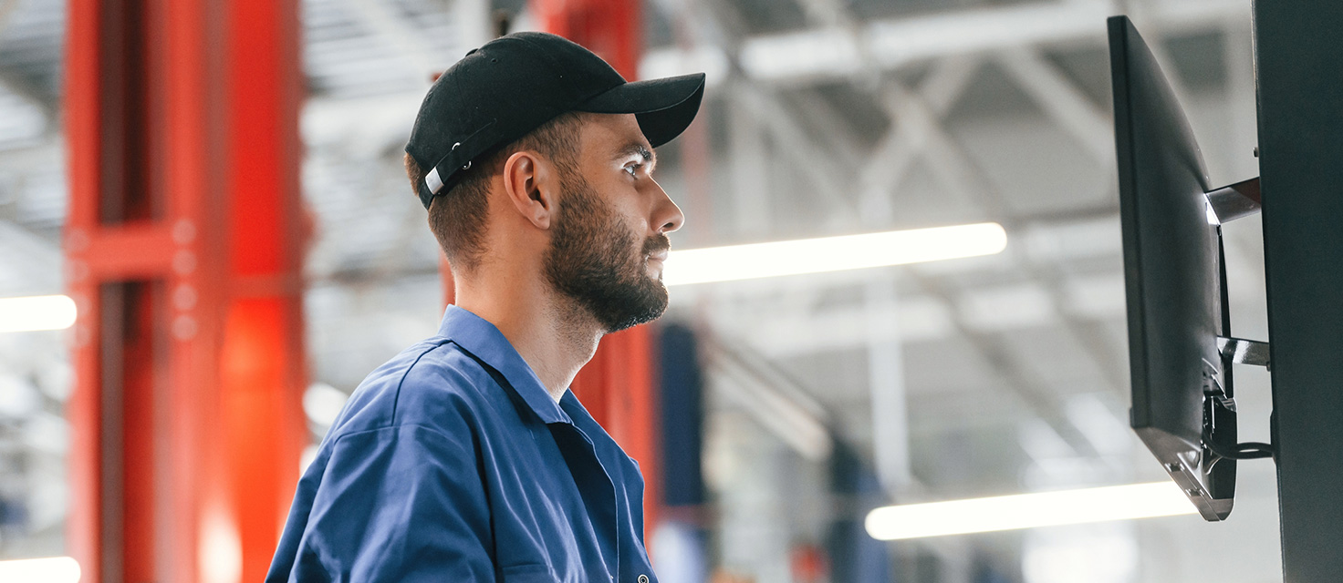 Tech in front of a computer